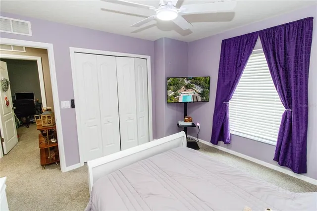 a view of a living room with clothes and shoes