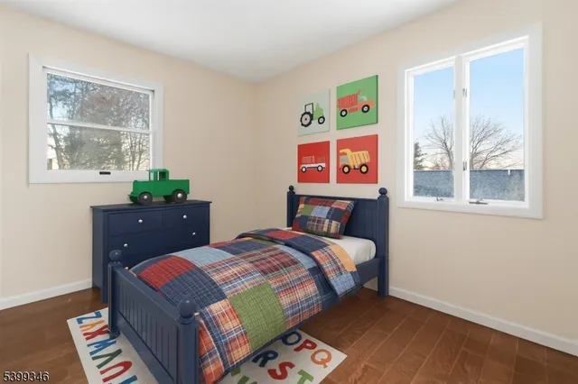 a bed room with a bed and a window