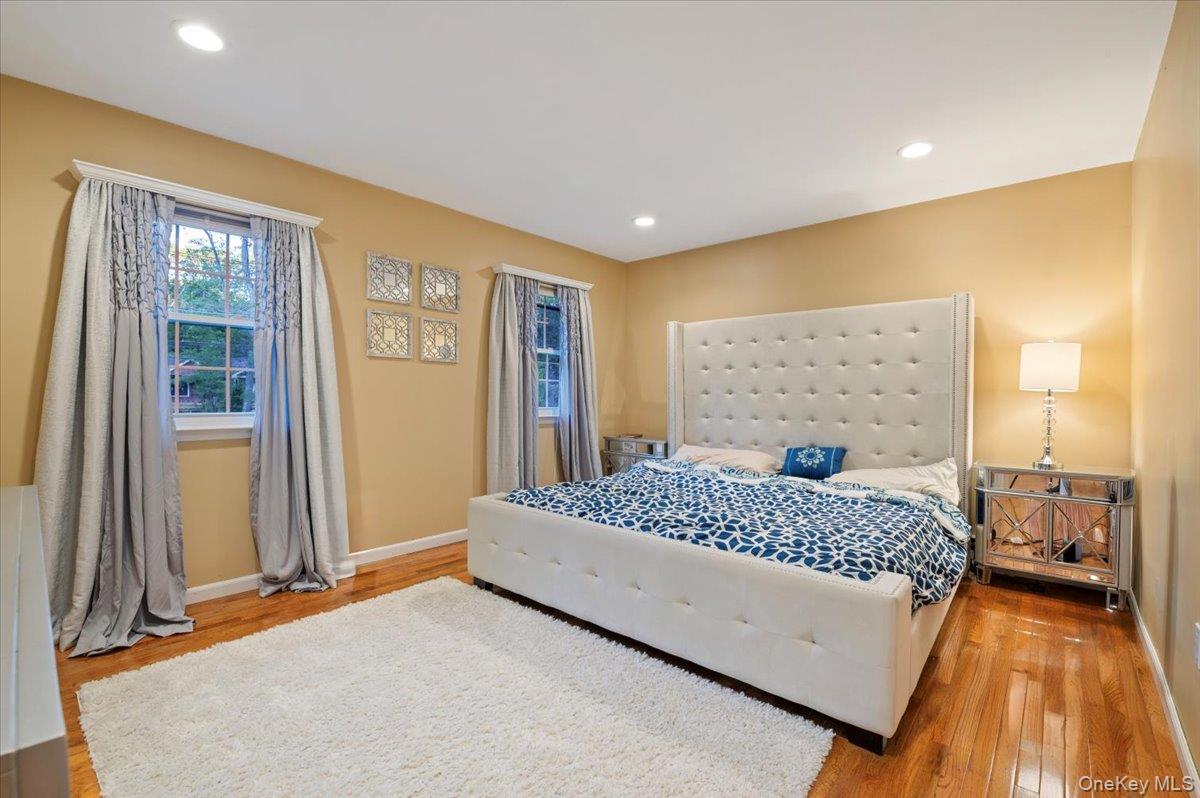 626 Caledonia Road Dix Hills, NY 11746 - Photo 33 of 50 Bedroom with light wood-style flooring and recessed lighting