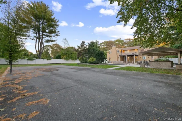 a view of house with outdoor space and trees