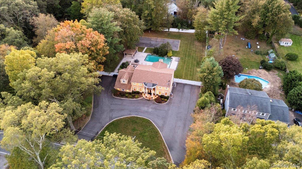 626 Caledonia Road Dix Hills, NY 11746 - Photo 47 of 50 Aerial view of property and surrounding area featuring a pool