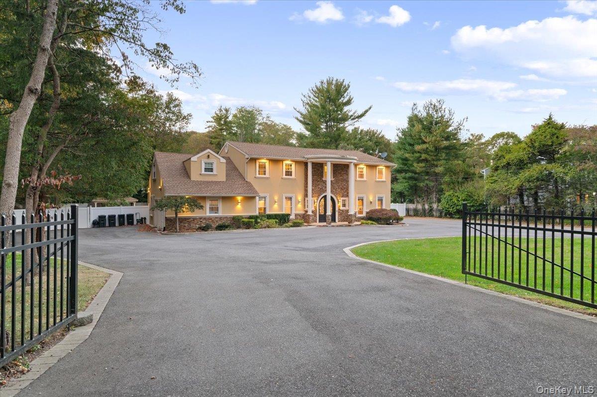 626 Caledonia Road Dix Hills, NY 11746 - Photo 50 of 50 View of front of property with stucco siding and driveway