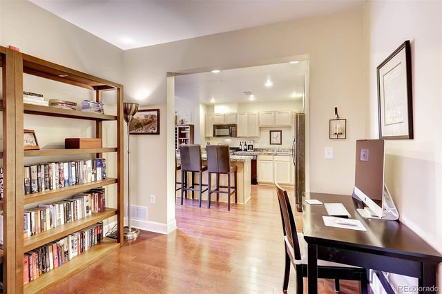 a dining room with furniture and a book shelf