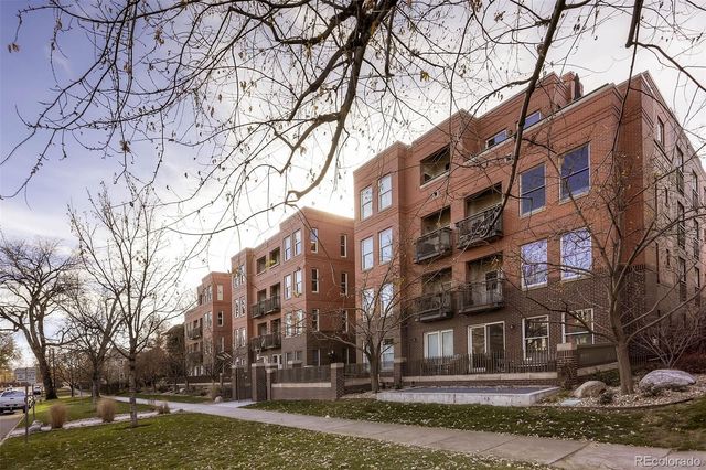 a view of a building with a yard