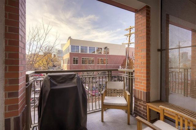 a view of buildings from the balcony