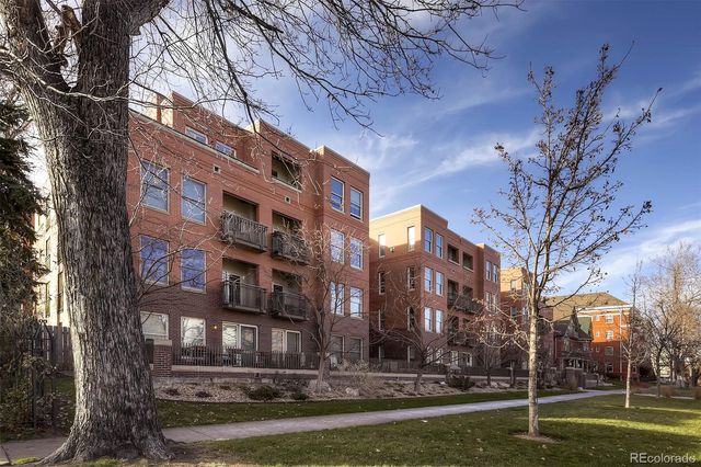 a view of a building with a yard