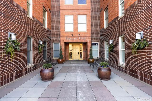 a view of an entryway with a flower garden