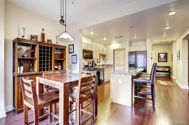 a view of a dining area with furniture and wooden floor