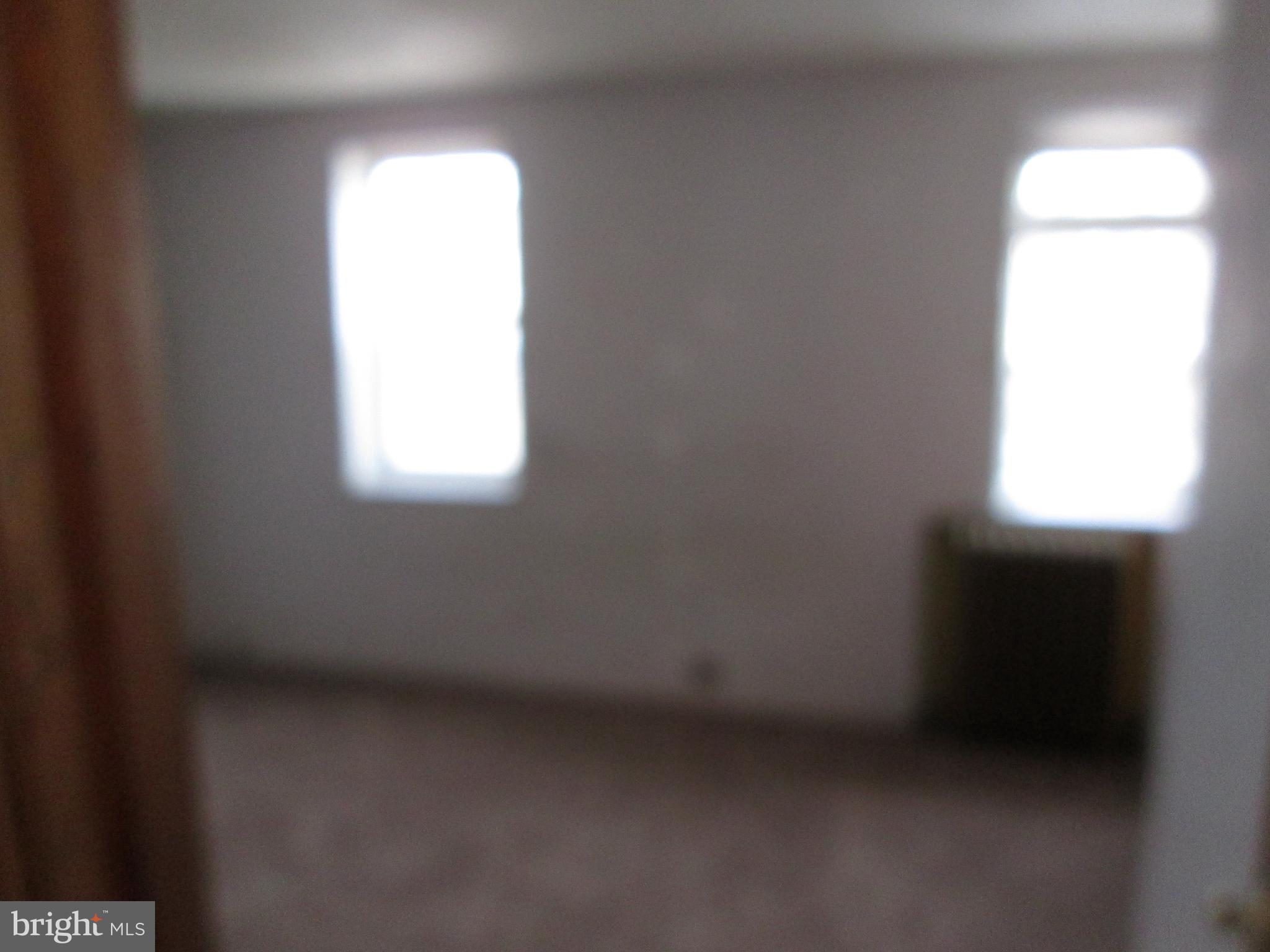 644 Copley Road Upper Darby, PA 19082 - Photo 38 of 47 a view of an empty room and a window