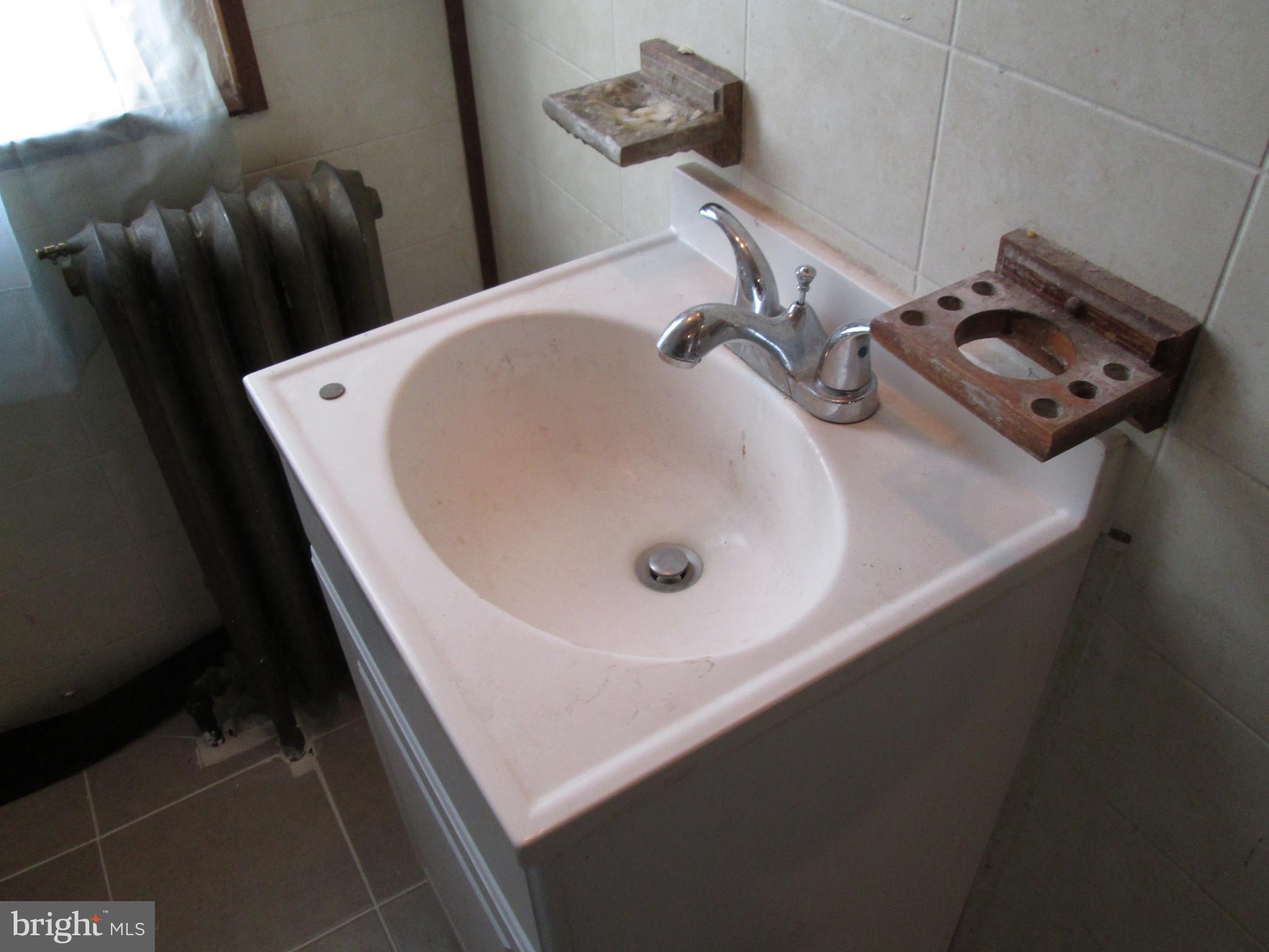 644 Copley Road Upper Darby, PA 19082 - Photo 44 of 47 a bathroom with a sink