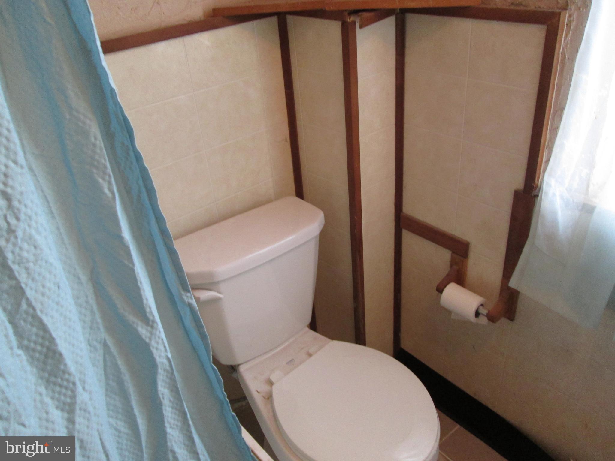 644 Copley Road Upper Darby, PA 19082 - Photo 45 of 47 a white toilet sitting next to a sink