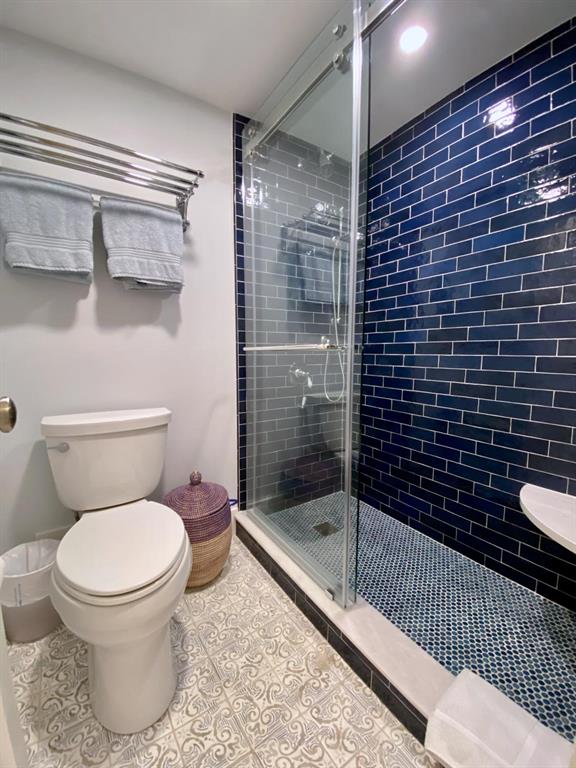 400 Beach Road, Unit 150 Vero Beach, FL 32963 - Photo 15 of 21 a bathroom with a toilet and a shower