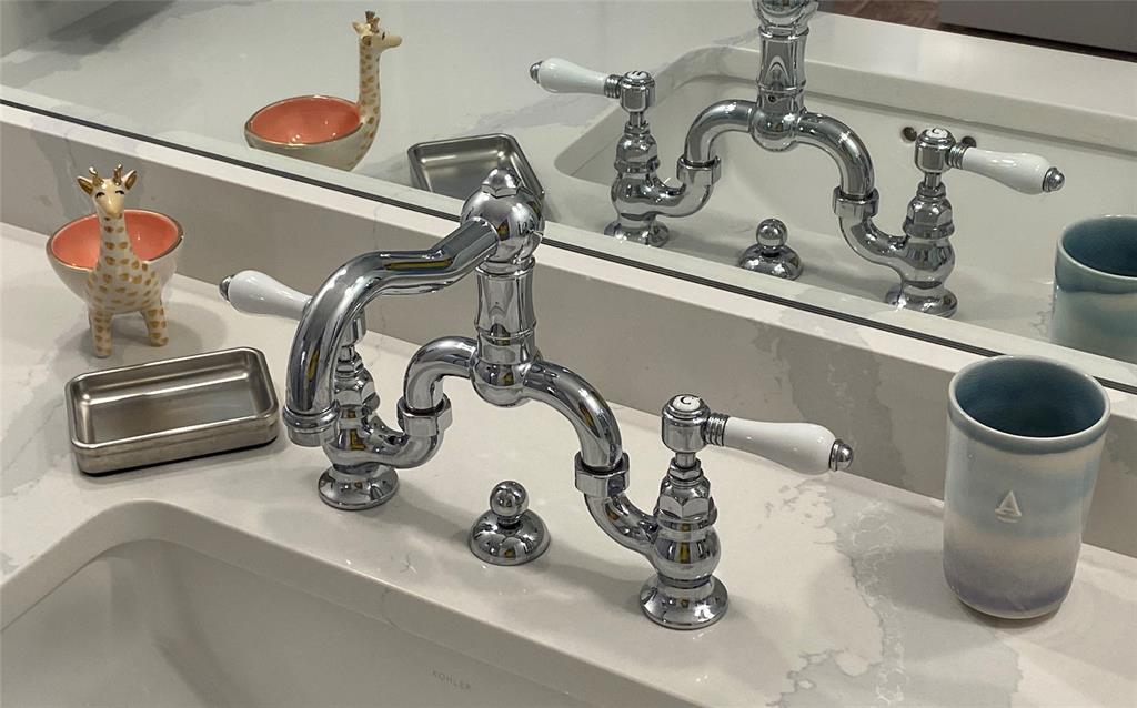 400 Beach Road, Unit 150 Vero Beach, FL 32963 - Photo 17 of 21 a bathroom with a sink and a mirror