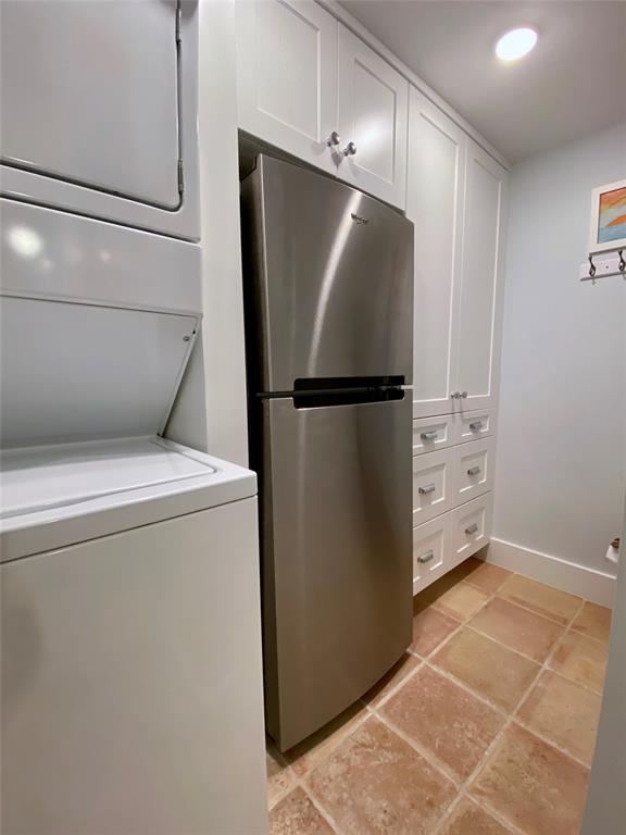 400 Beach Road, Unit 150 Vero Beach, FL 32963 - Photo 18 of 21 a utility room with washer and dryer