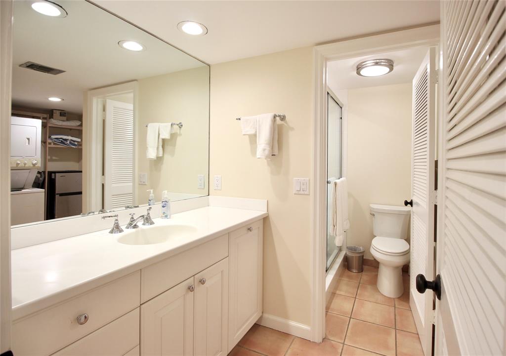 400 Beach Road, Unit 150 Vero Beach, FL 32963 - Photo 2 of 21 a bathroom with a sink a toilet and shower
