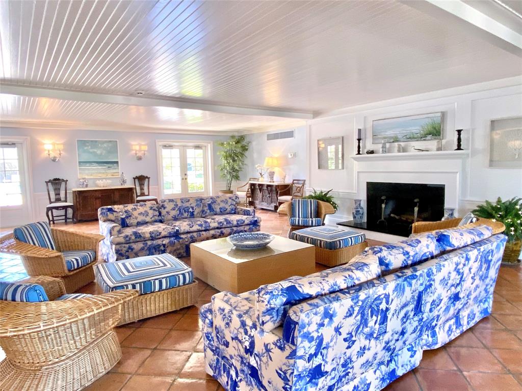 400 Beach Road, Unit 150 Vero Beach, FL 32963 - Photo 21 of 21 a living room with furniture a fireplace and a table