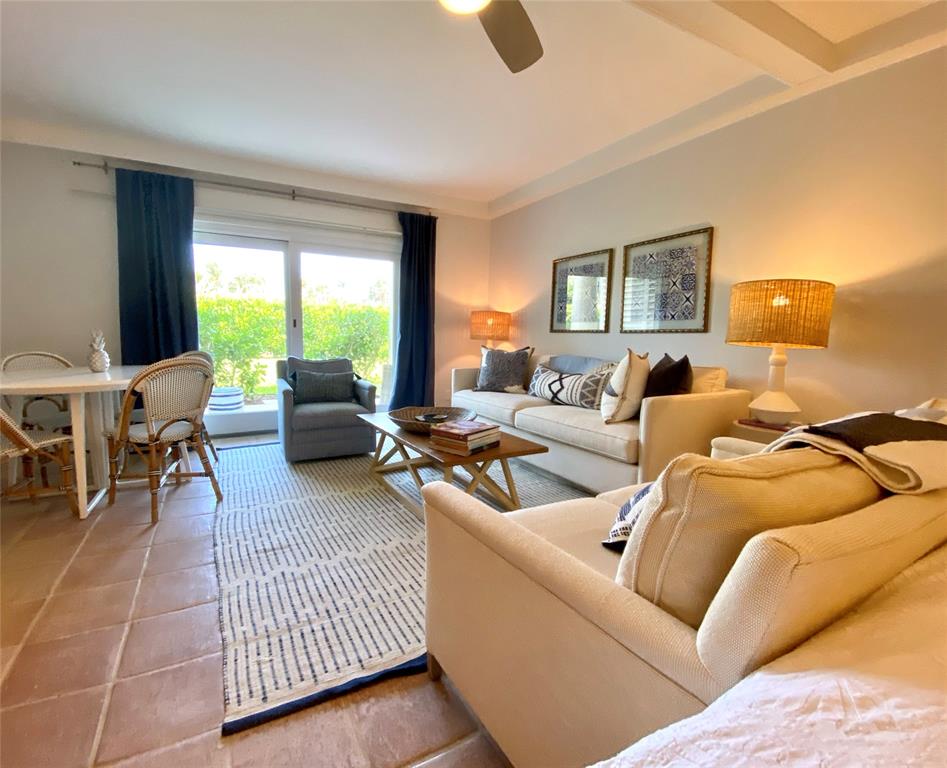 400 Beach Road, Unit 150 Vero Beach, FL 32963 - Photo 3 of 21 a living room with furniture and a large window