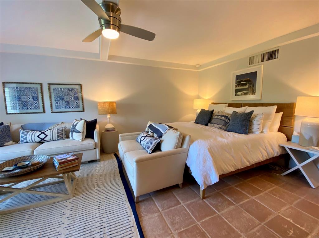 400 Beach Road, Unit 150 Vero Beach, FL 32963 - Photo 5 of 21 a spacious bedroom with a bed and a couch