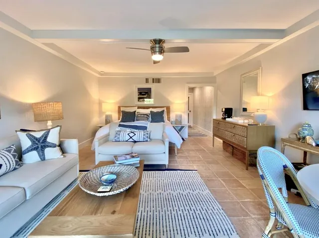 a living room with furniture and a table