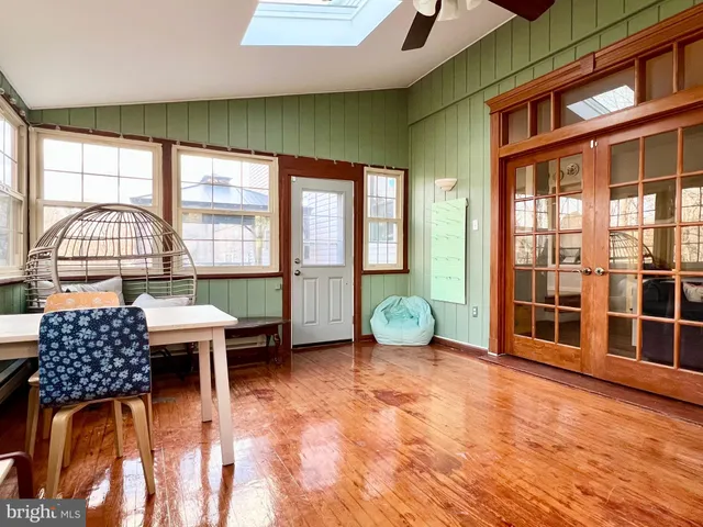 a room with furniture and a floor to ceiling window