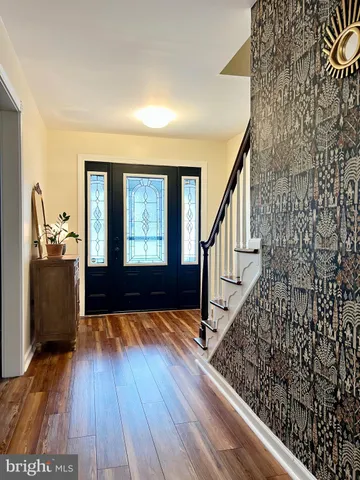a view of entryway with wooden floor