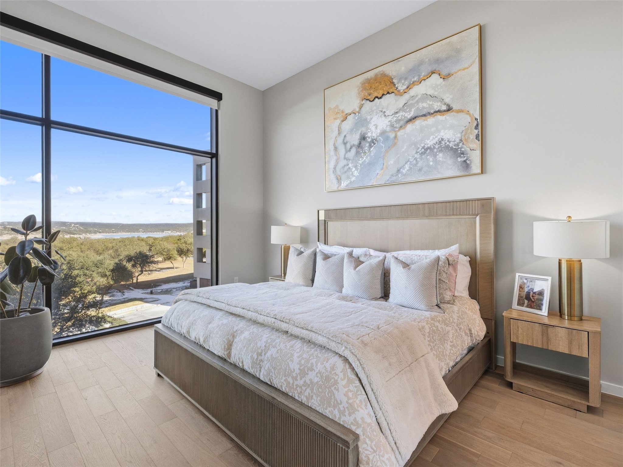 5921 Hiline Road, Unit 1303 Austin, TX 78734 - Photo 17 of 37 a bedroom with a large bed and a couch