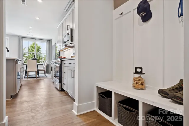 a kitchen with stainless steel appliances granite countertop a refrigerator and a stove