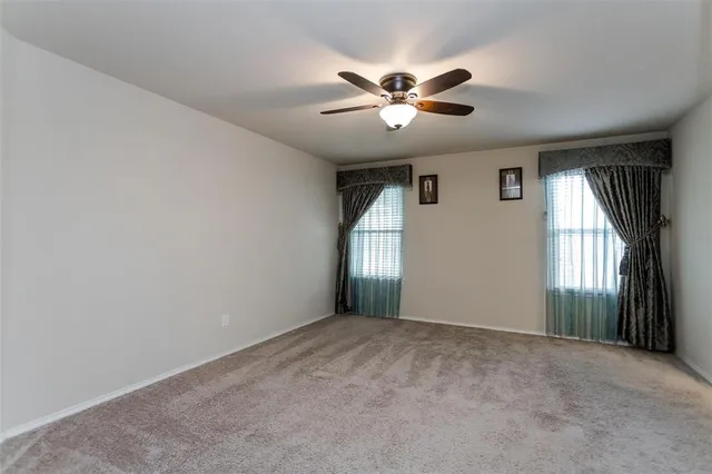 a view of empty room with windows