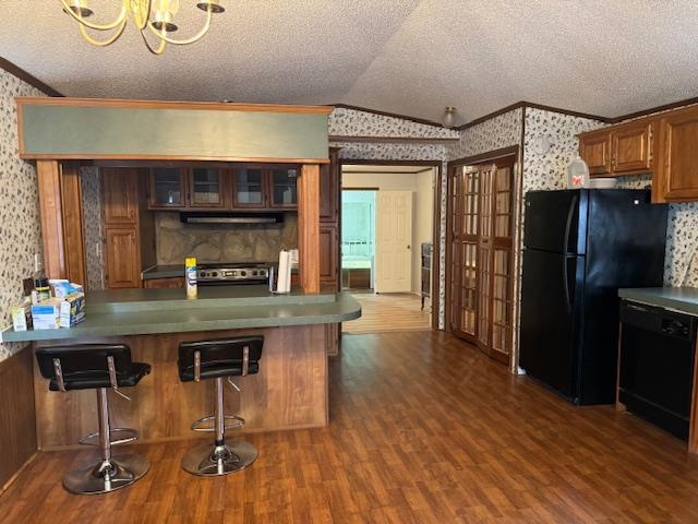 367 Eldie Foster Road Pocahontas, TN 38061 - Photo 5 of 14 Kitchen with wallpapered walls, crown molding, black appliances, and lofted ceiling