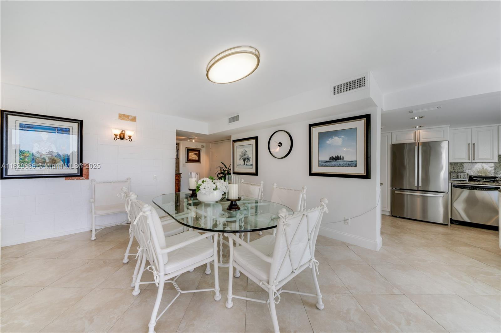 609 Ocean Drive, Unit 5H Key Biscayne, FL 33149 - Photo 11 of 28 a view of a dining room with furniture
