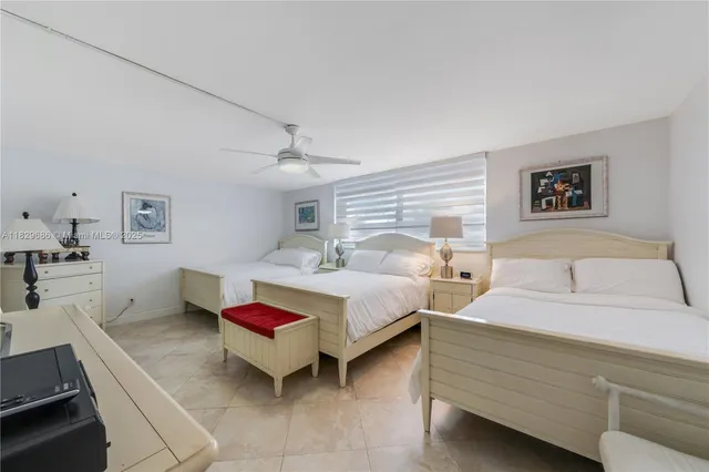 a bedroom with bed and window