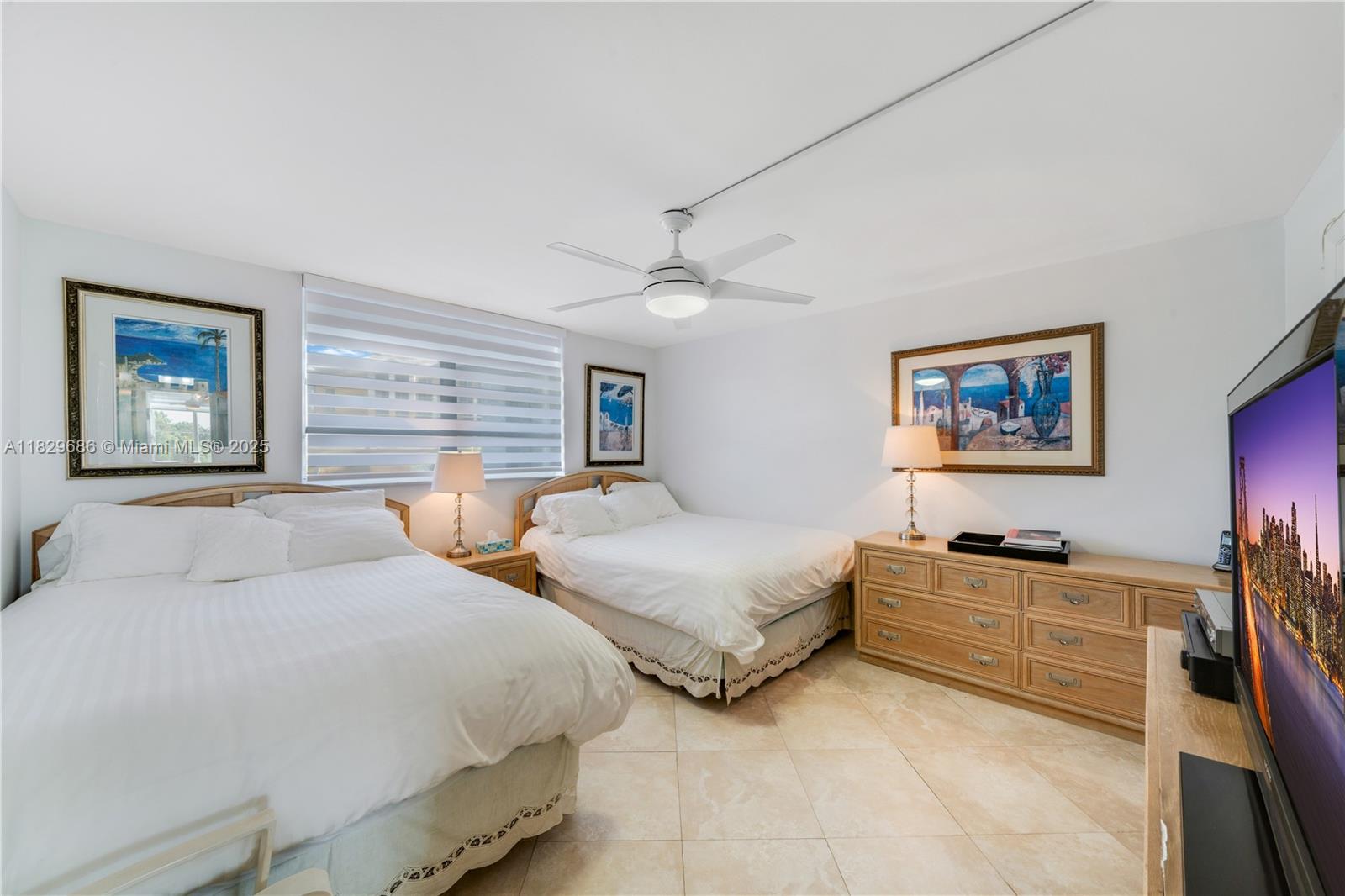 609 Ocean Drive, Unit 5H Key Biscayne, FL 33149 - Photo 10 of 28 a bedroom with two beds and a desk