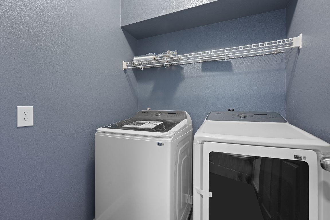 14517 Harris Ridge Boulevard, Unit B Pflugerville, TX 78660 - Photo 15 of 26 a utility room with dryer and washer