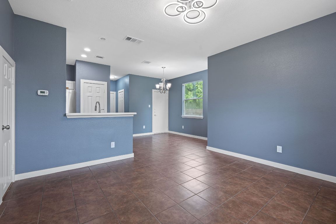 14517 Harris Ridge Boulevard, Unit B Pflugerville, TX 78660 - Photo 5 of 26 a view of a kitchen with a dishwasher and a window
