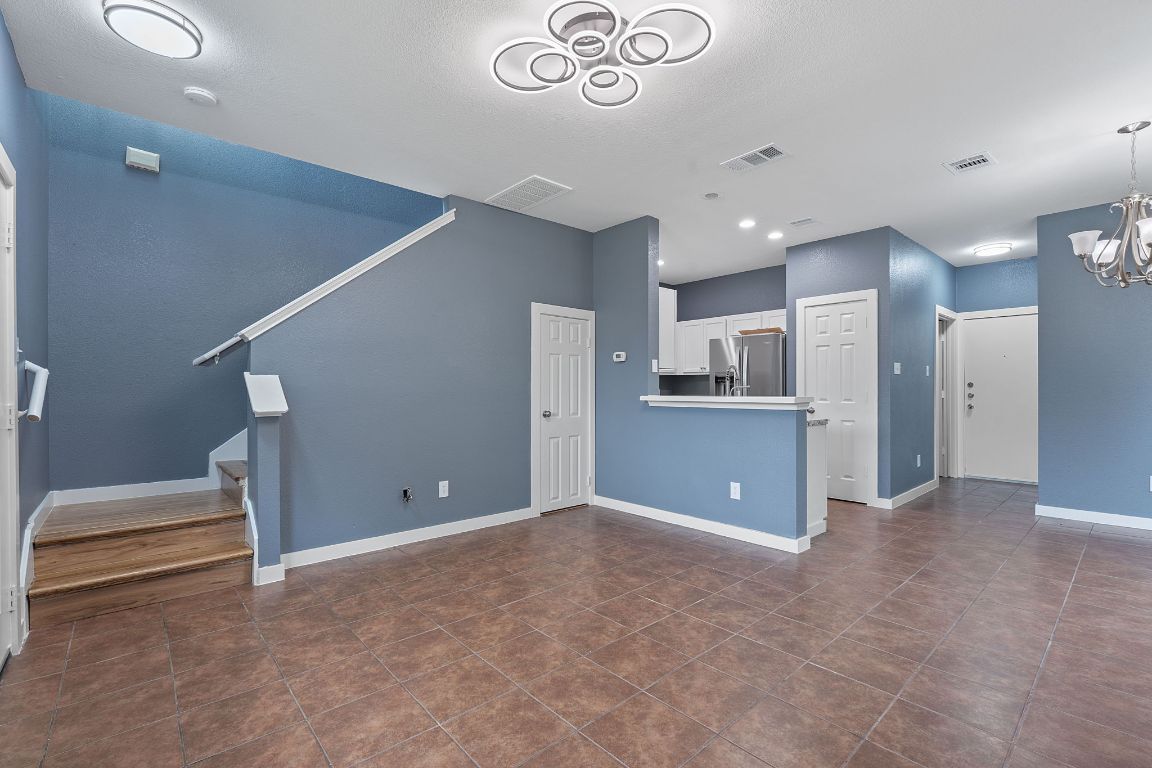 14517 Harris Ridge Boulevard, Unit B Pflugerville, TX 78660 - Photo 8 of 26 a view of kitchen and a refrigerator