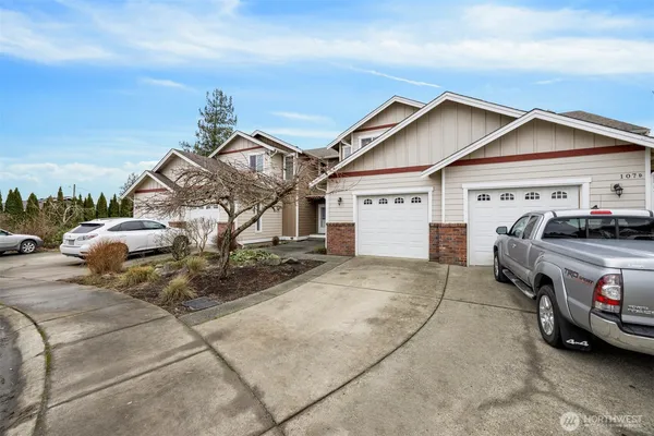 a view of a car park in front of house