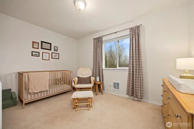 a living room with furniture and book shelf