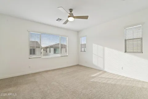 a bathroom with a double vanity sink a mirror and a bathtub