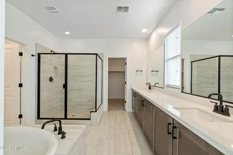 a bathroom with a tub and shower