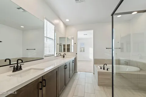 a bathroom with a shower and a sink
