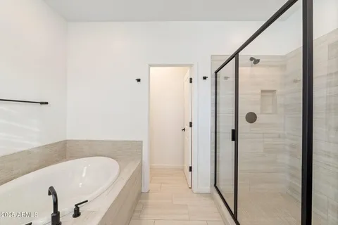 a bathroom with a bathtub and a sink