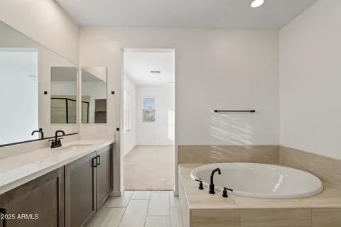 an empty room with a ceiling fan and a fan