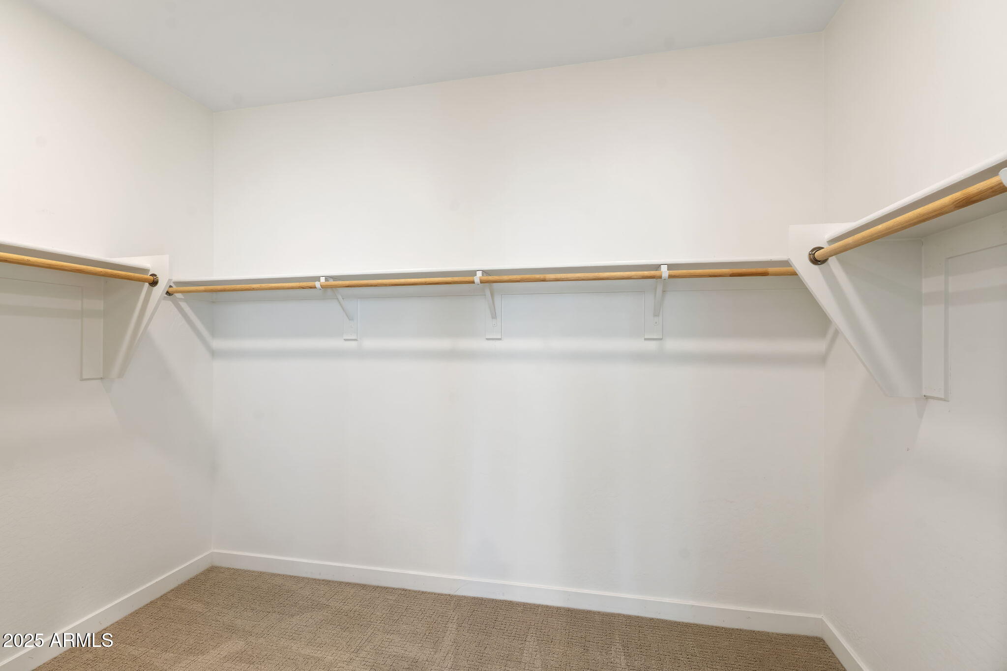 6428 North 17th Place Phoenix, AZ 85016 - Photo 35 of 48 a view of walk in closet with empty racks