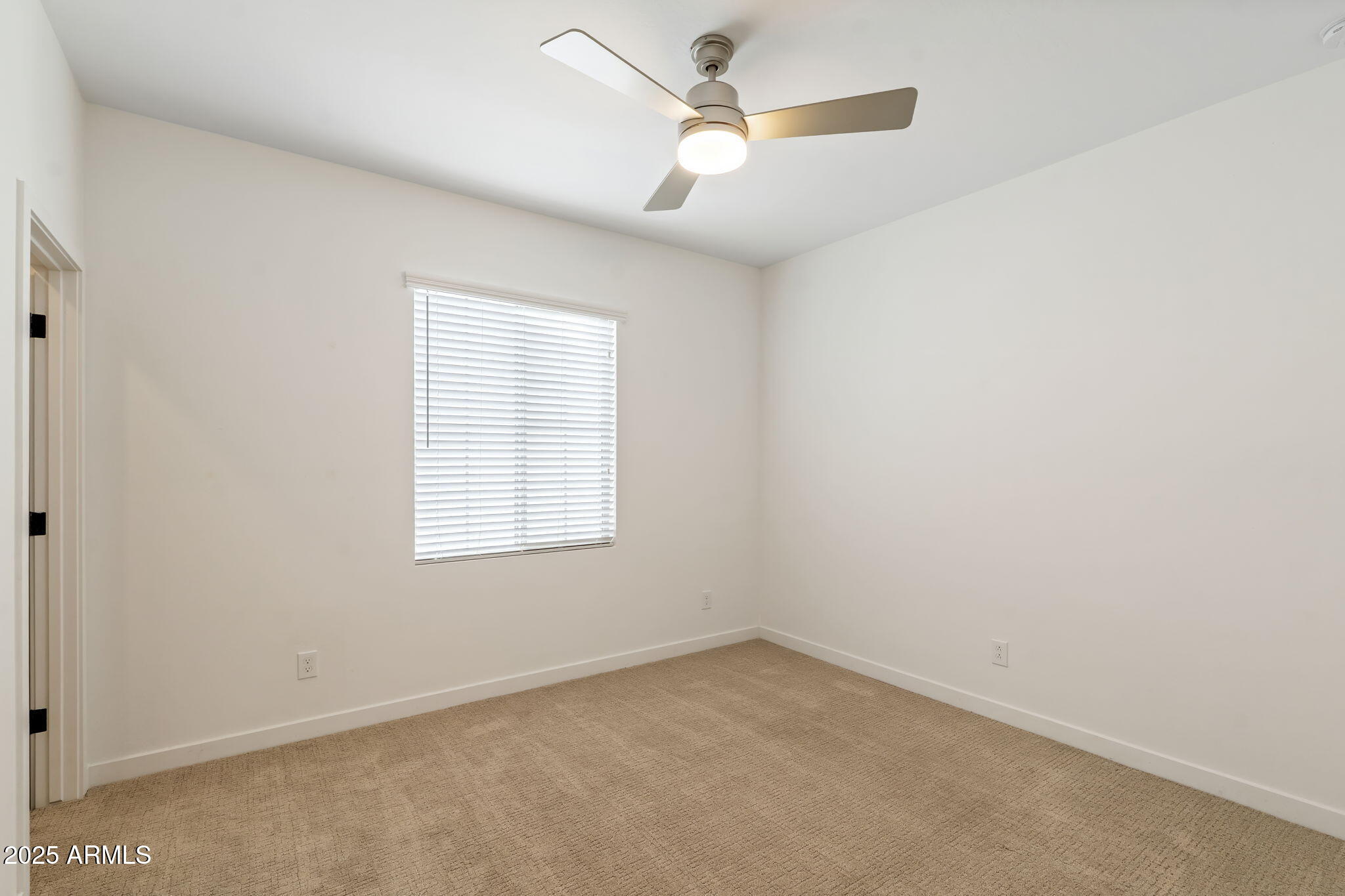 6428 North 17th Place Phoenix, AZ 85016 - Photo 36 of 48 an empty room with a window and a fan