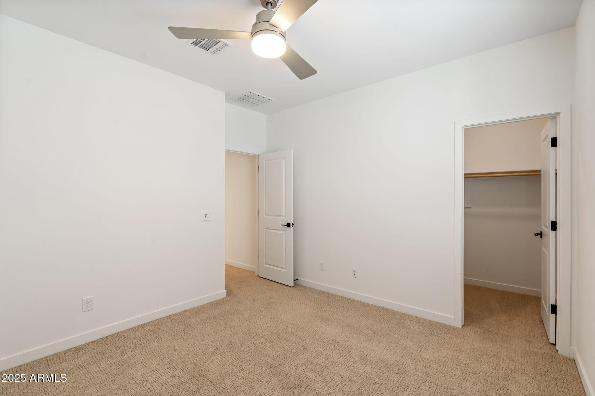 6428 North 17th Place Phoenix, AZ 85016 - Photo 37 of 48 an empty room with a ceiling fan and a fan