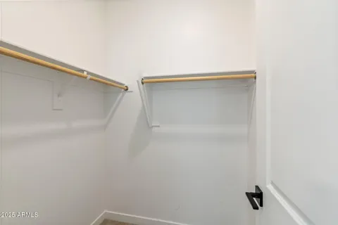 a bathroom with double sink and a mirror