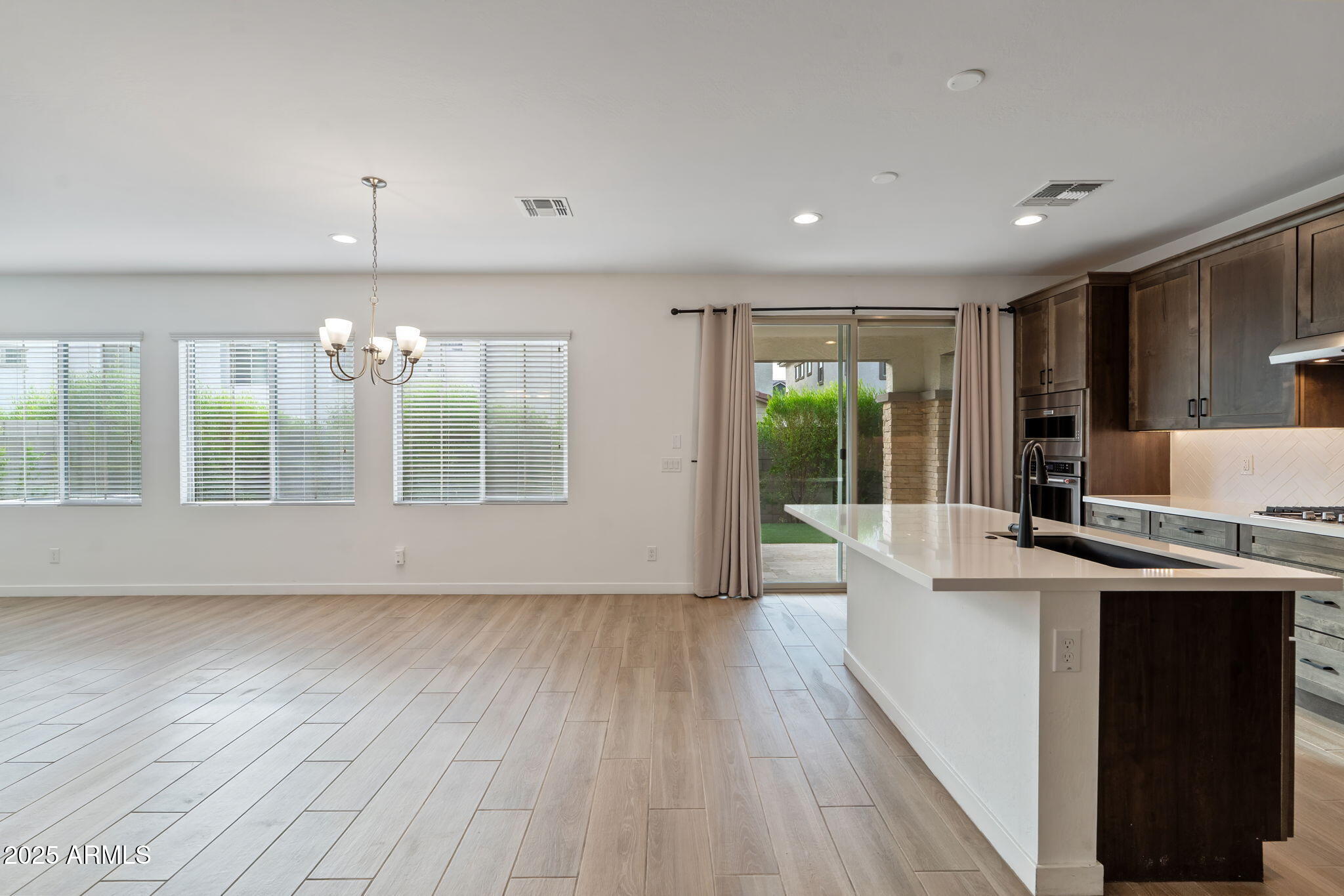 6428 North 17th Place Phoenix, AZ 85016 - Photo 4 of 48 wooden floor in an empty room with a window