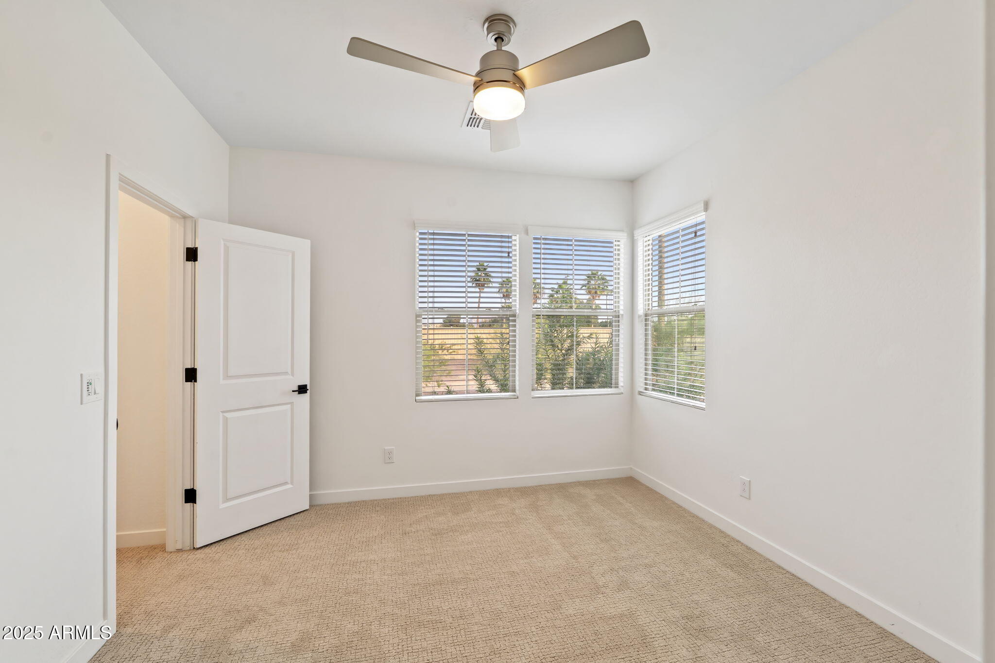 6428 North 17th Place Phoenix, AZ 85016 - Photo 43 of 48 a view of empty room with window and ceiling fan