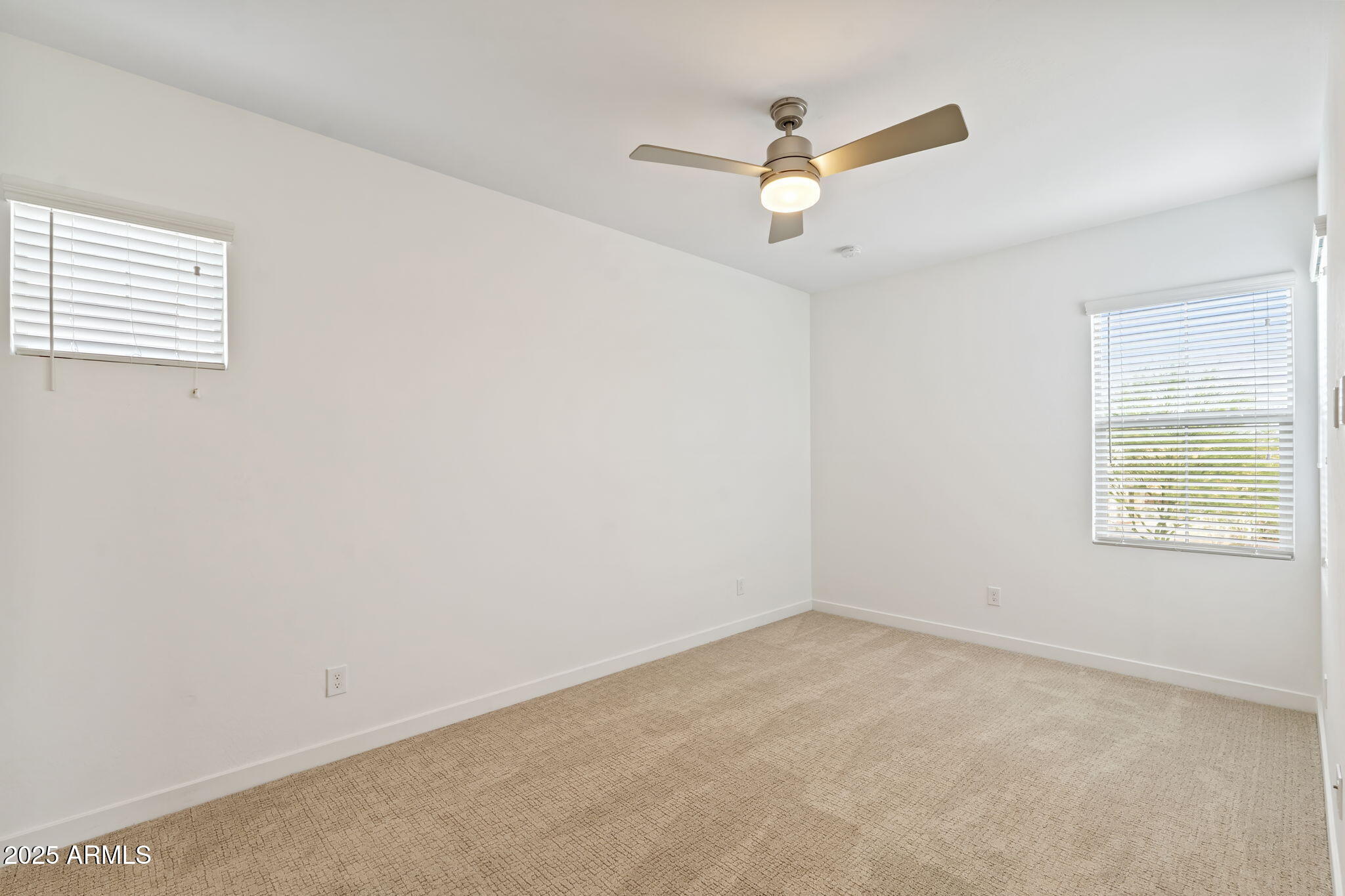 6428 North 17th Place Phoenix, AZ 85016 - Photo 44 of 48 an empty room with a window and a fan