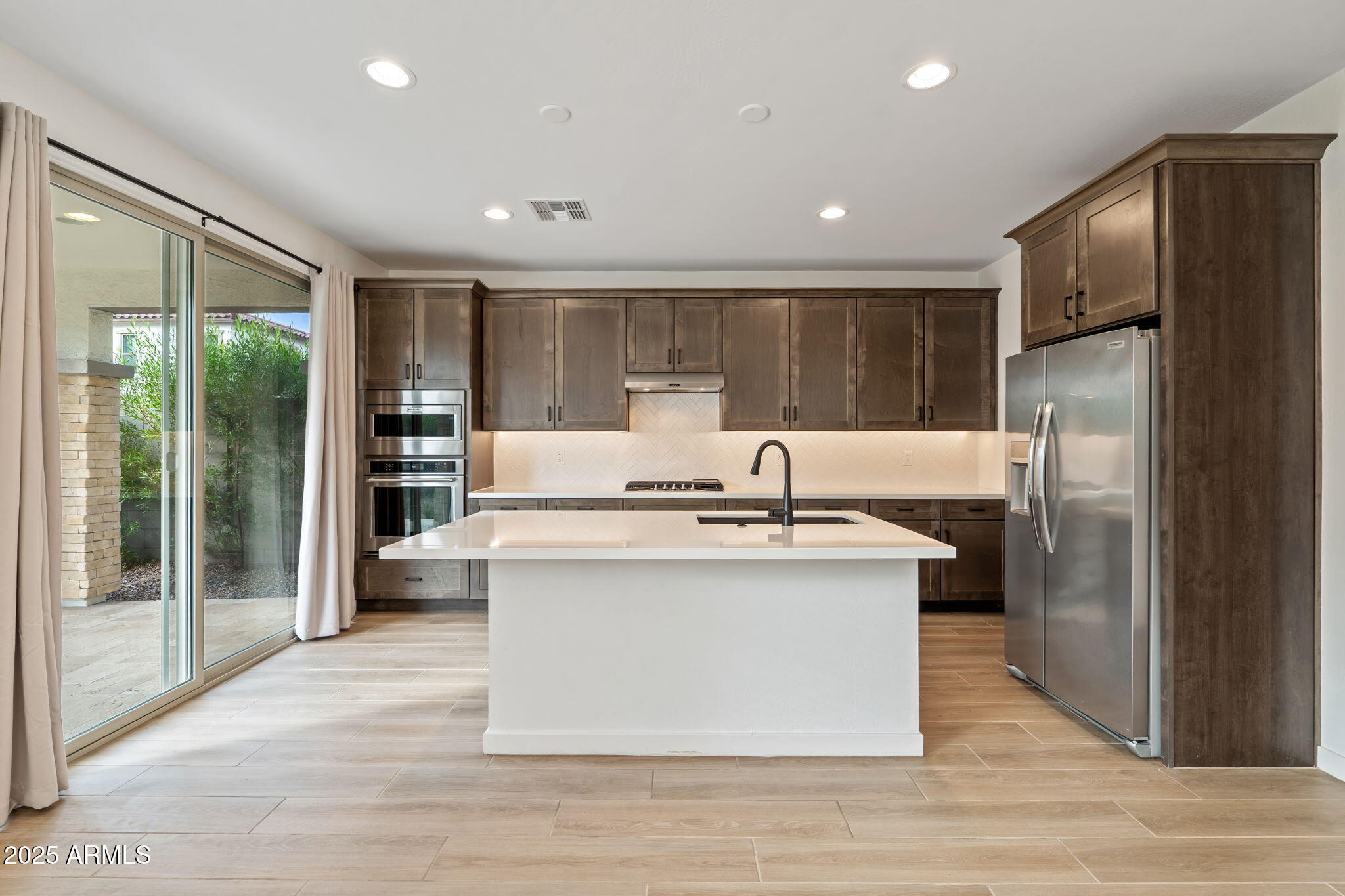 6428 North 17th Place Phoenix, AZ 85016 - Photo 5 of 48 a kitchen with stainless steel appliances granite countertop a sink stove and refrigerator